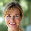 A smiling woman, Elara Vance, aged 48, radiating health and vitality.
