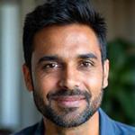 Headshot of Dr. Aaron Patel, a calm and confident Clinical Psychologist.